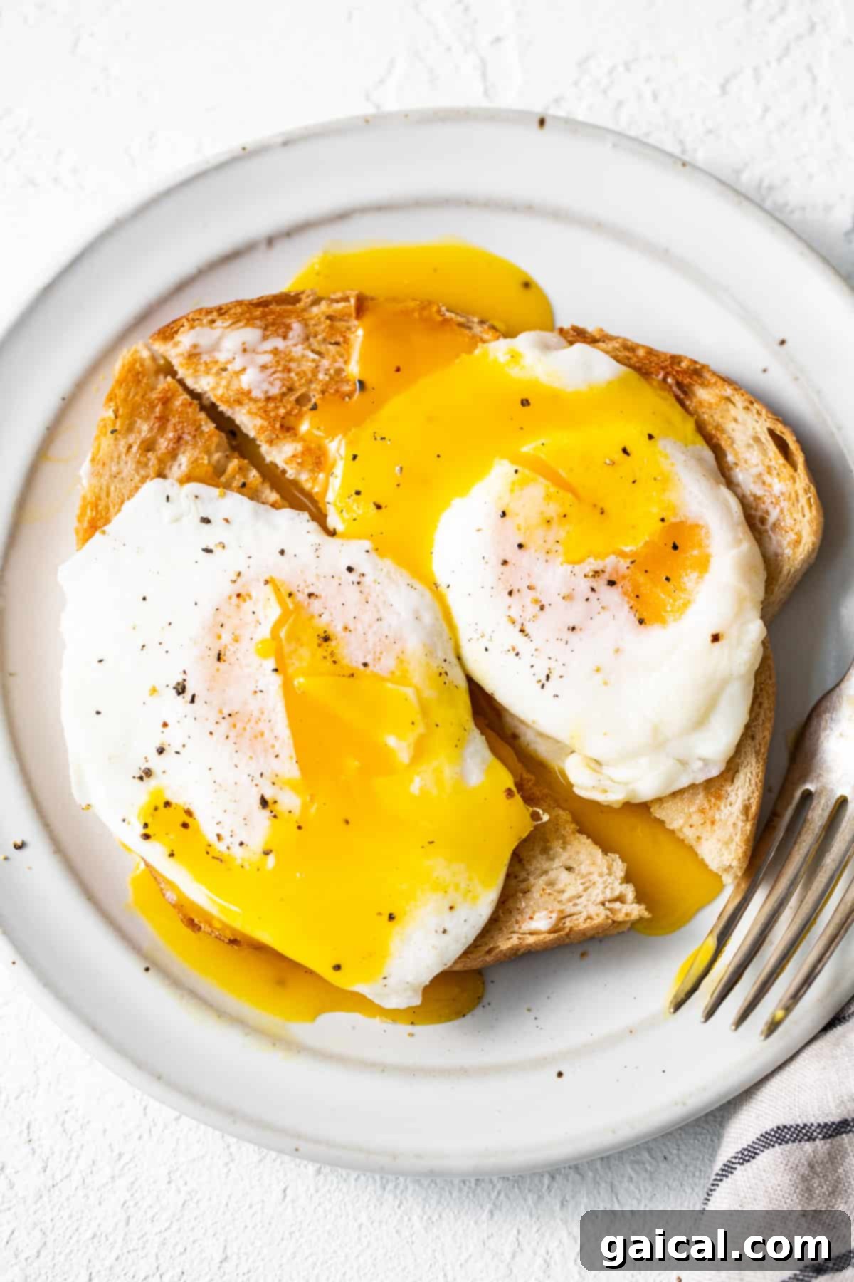Liquid Gold Breakfast 8 Over easy eggs served beautifully over a slice of toast.