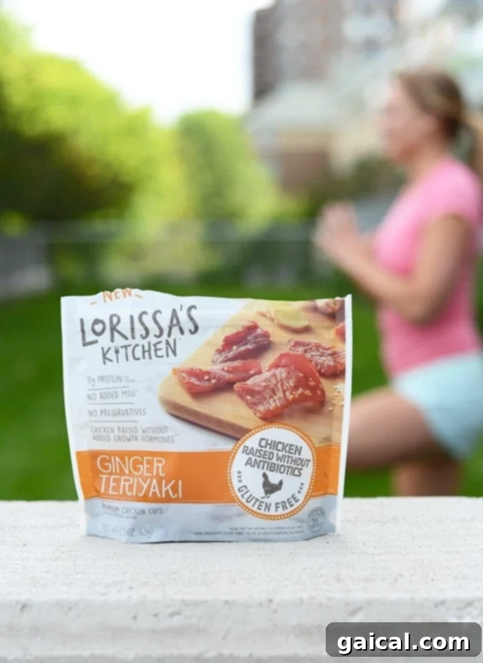 Woman enjoying a Lorissa's Kitchen protein snack outdoors, reflecting a healthy, active lifestyle.