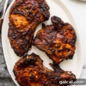 Golden brown air fryer pork chops, ready to be enjoyed.