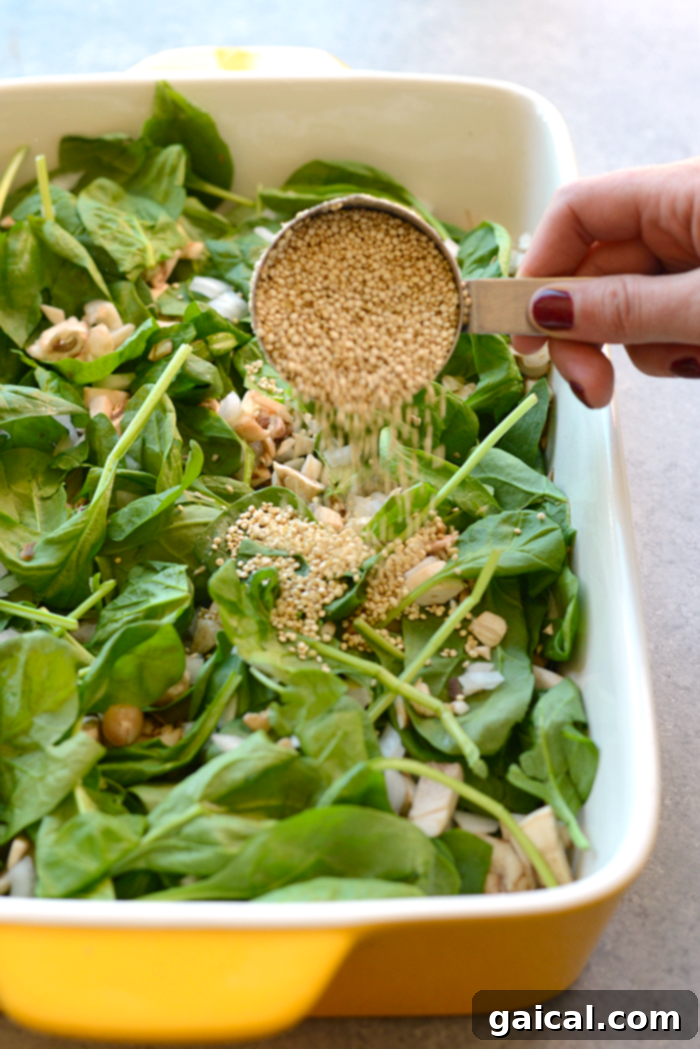 Ingredients for Spinach Quinoa Lasagna Casserole laid out on a kitchen counter.