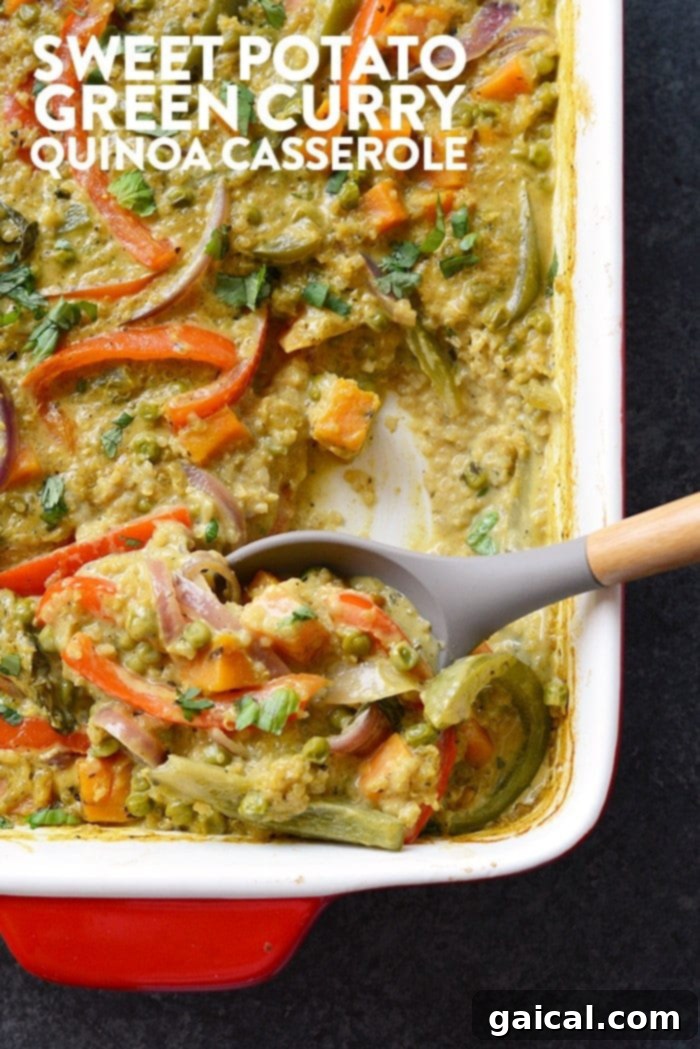 A vibrant Sweet Potato Green Curry Quinoa Casserole, freshly baked and ready to serve, garnished with fresh herbs.