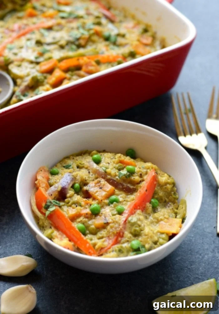 Close-up of the rich and creamy texture of the Sweet Potato Green Curry Quinoa Casserole with visible quinoa grains and vegetables.