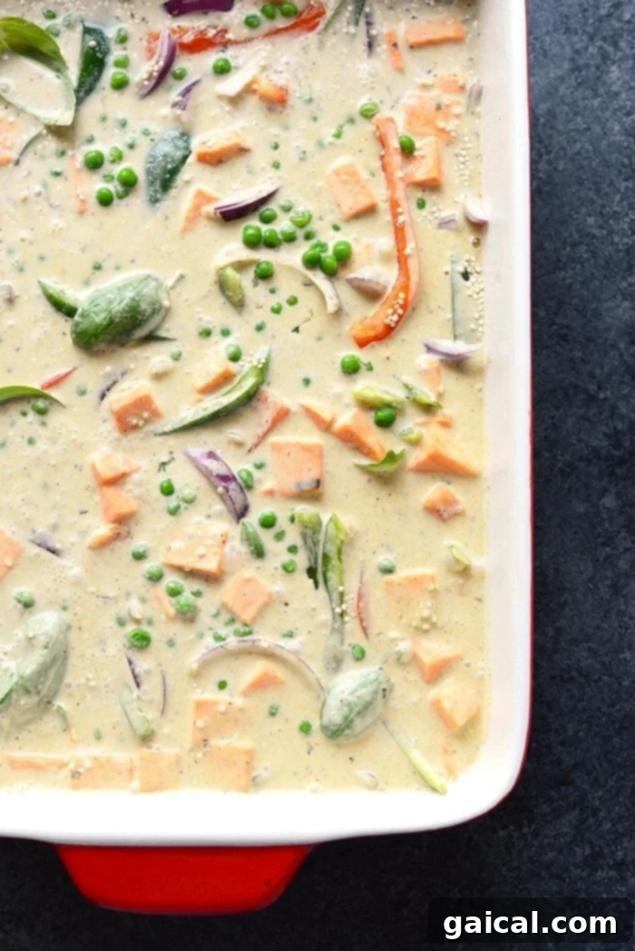 A full Sweet Potato Green Curry Quinoa Casserole dish ready to be served, showcasing its hearty ingredients.