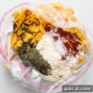 A plastic bag filled with various ingredients for breading chicken.