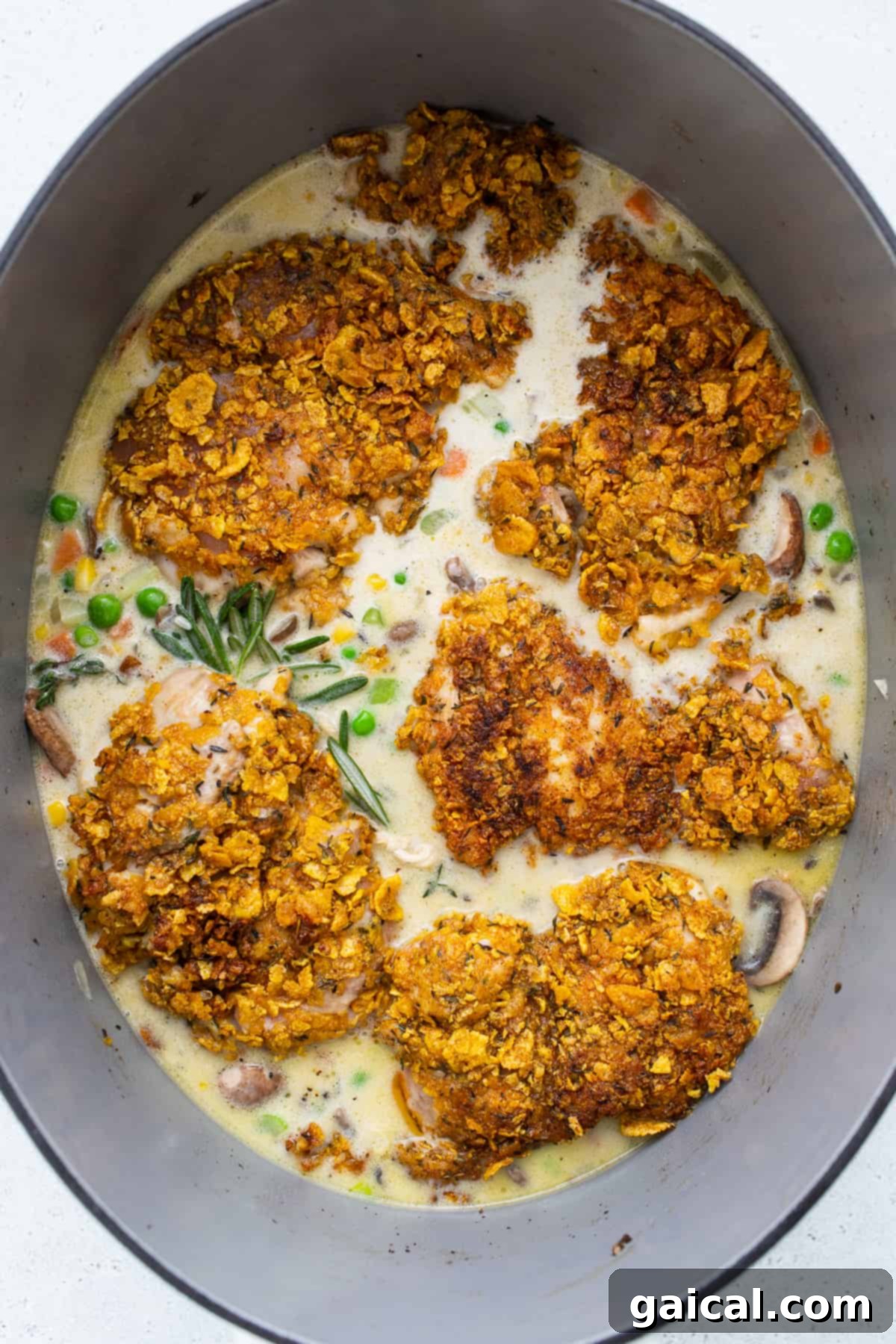 A chicken pot pie skillet, baked to golden perfection, ready to be served directly from the pan.