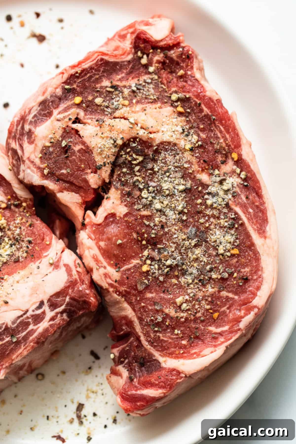 Make your own homemade steak seasoning with just 5 ingredients you likely already have in your spice cupboard, and you’ll be on your way to the most flavorful steak in no time. Raw steak generously seasoned with homemade steak rub, ready for cooking.