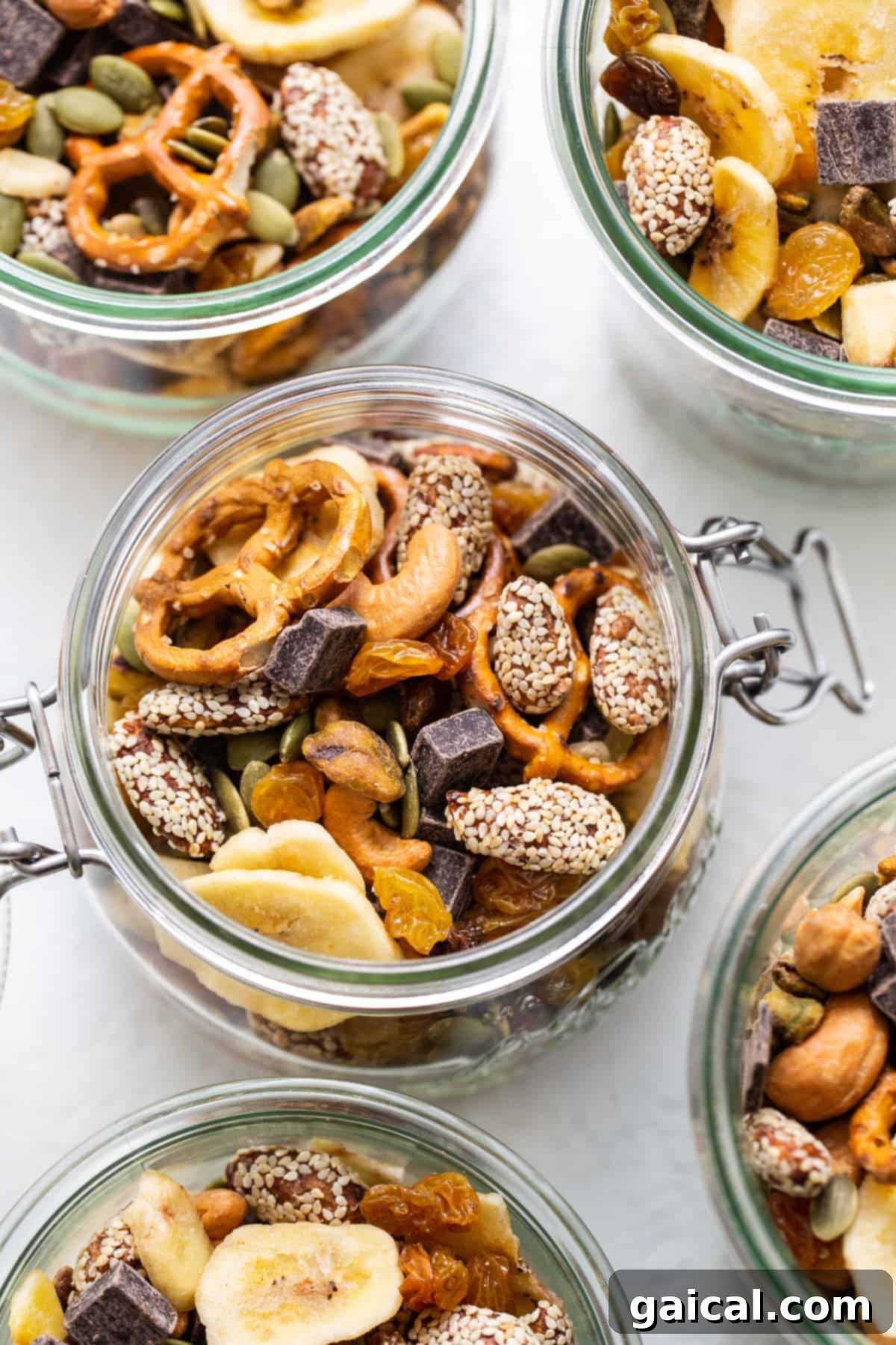 This healthy homemade trail mix is the perfect snack to satisfy all your sweet and salty cravings. Homemade trail mix in a mason jar.
