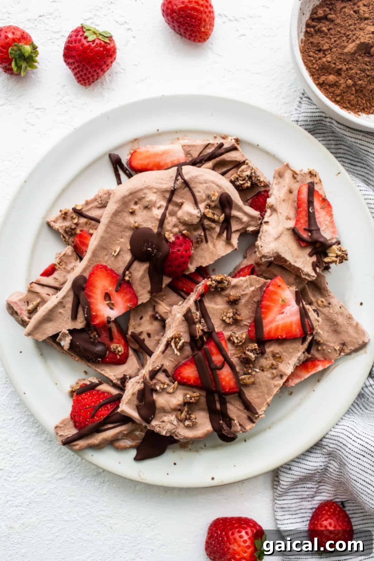Delicious chocolate strawberry frozen yogurt bark for a healthy treat Frozen yogurt bark on a plate.