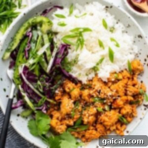 Ground chicken bowls with rice and coleslaw, showing a complete, ready-to-eat meal.