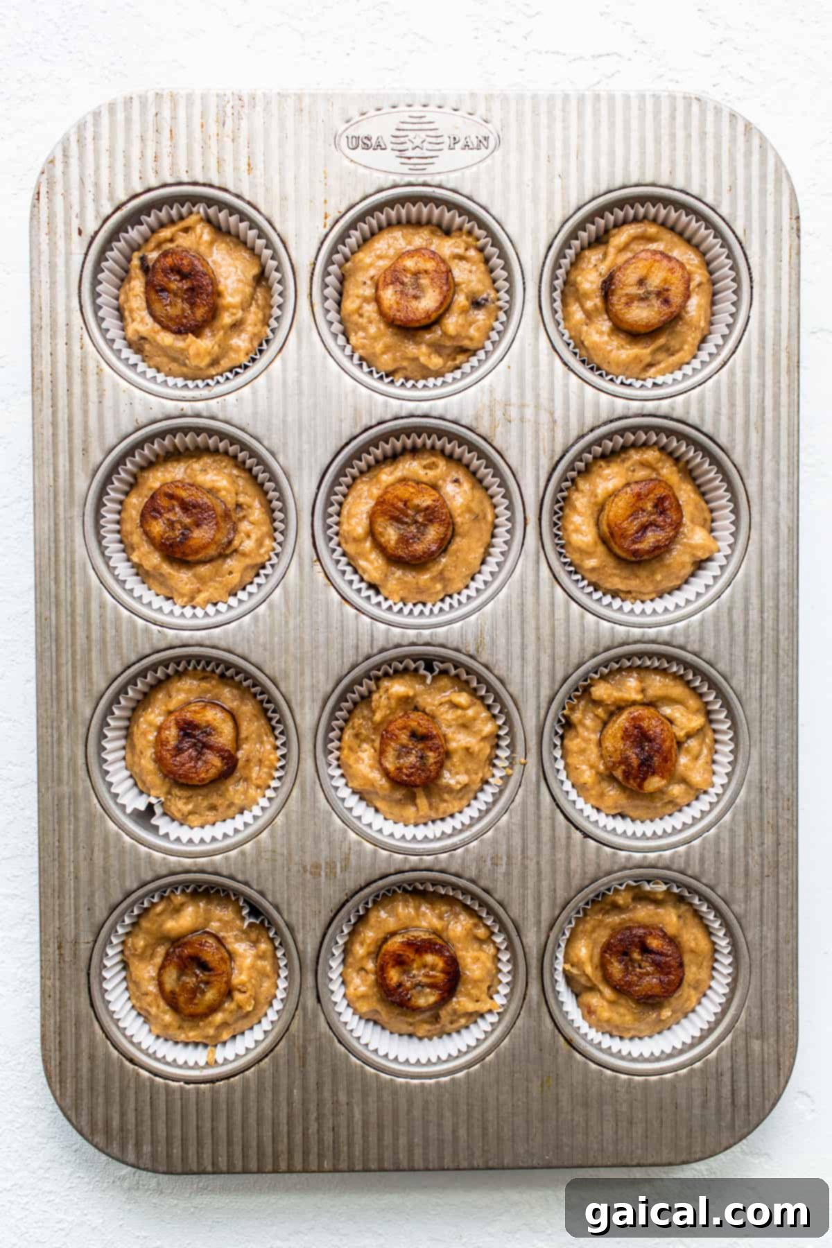 Freshly baked Bananas Foster muffins cooling on a wire rack