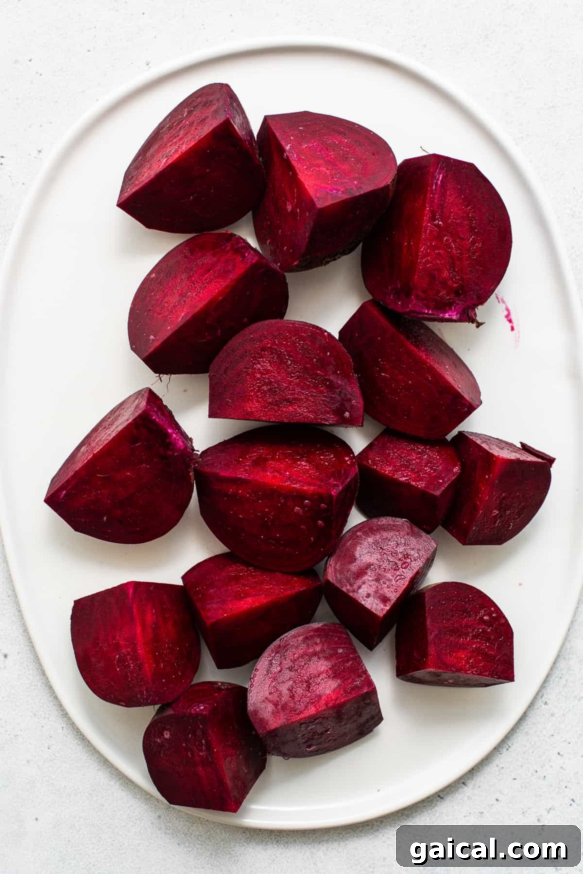 Unlocking the Flavor of Beets 4 Beautifully sliced roasted beets on a white plate.