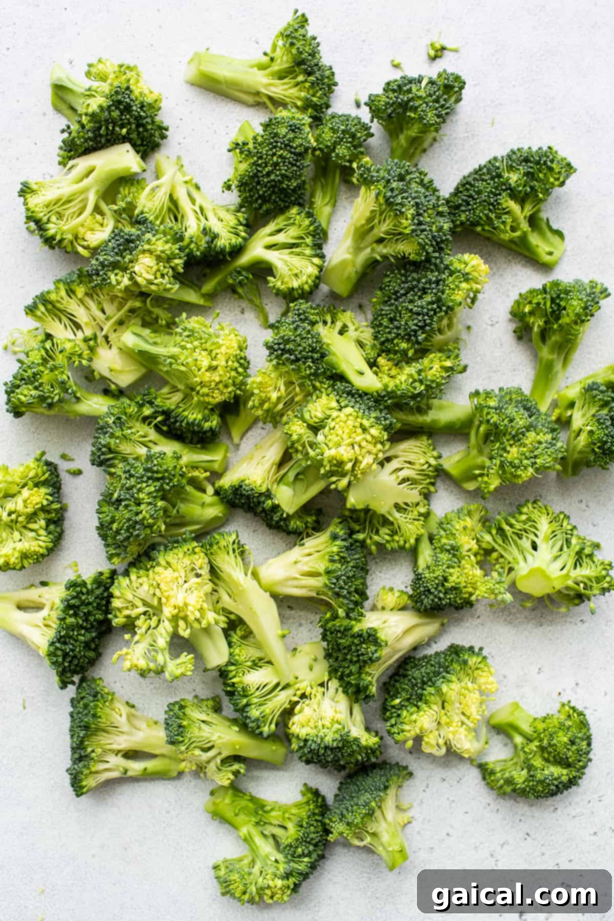 Fresh Broccoli Florets Fresh, vibrant green broccoli florets neatly arranged, highlighting their natural texture and readiness for roasting.