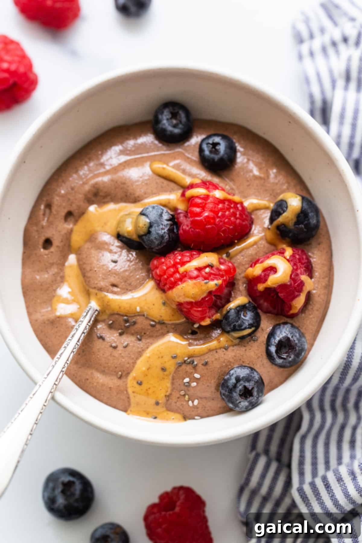 Creamy Blended Peanut Butter Chocolate Chia Seed Pudding - A Healthy Indulgence Blended chia seed pudding in a bowl topped with peanut butter and chocolate chips.
