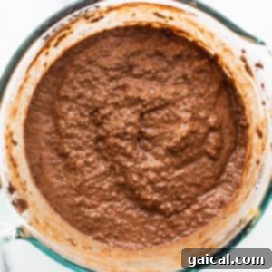 Chocolate batter in a glass bowl.