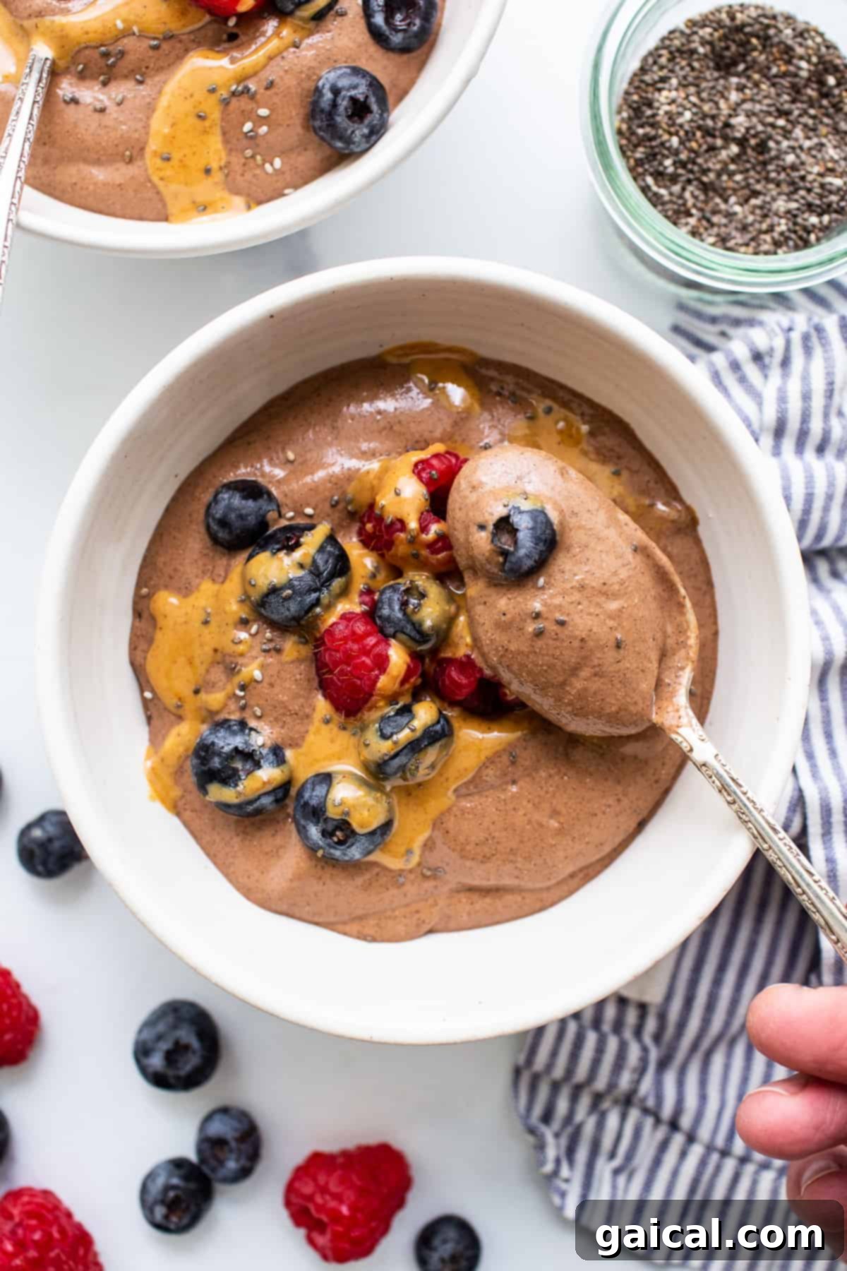 Creamy Blended Chia Seed Pudding Ready to Enjoy Blended chia seed pudding in a bowl with a spoon, ready to be eaten.