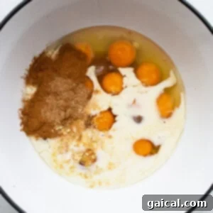 A bowl with eggs and spices in it.
