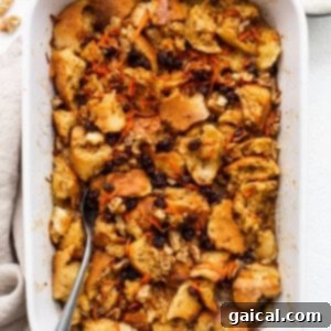 A white baking dish filled with bread and carrots.