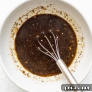 Mastering Skirt Steak Cooking 11 Marinade ingredients whisked together in a bowl.