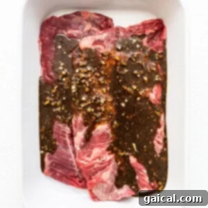 Mastering Skirt Steak Cooking 5 Skirt steak with marinade in a bag, showing the marination process.