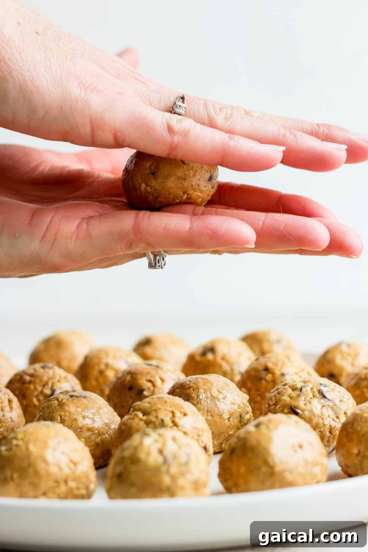 Rolling Collagen Cookie Dough rolling ball in between palms.