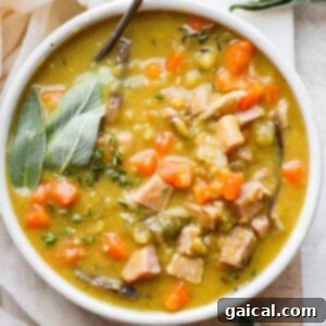 Bowl of split pea soup with ham.
