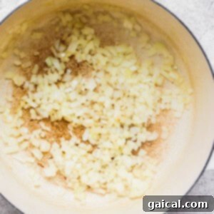 Hearty Ham and Split Pea Soup 10 A pan with onions and garlic in it.