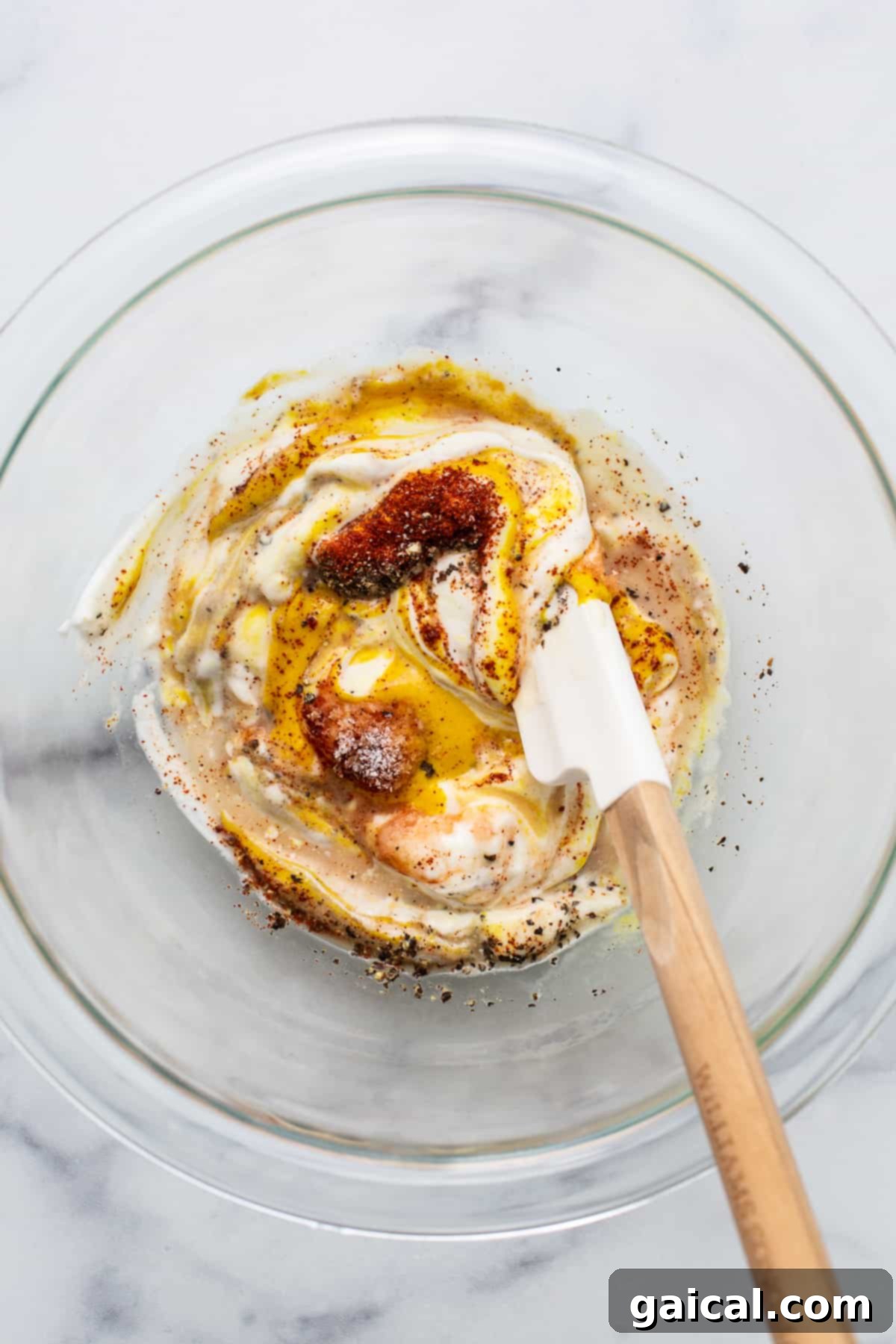 Classic egg salad is made with perfectly cooked hard-boiled eggs and a yummy sauce. A smooth and creamy egg salad dressing being meticulously mixed in a bowl, showcasing its rich and appealing texture.