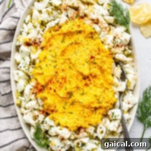 The Secret to Irresistible Egg Salad 2 A creamy and rich deviled egg salad serving, artfully garnished with a sprinkle of paprika.