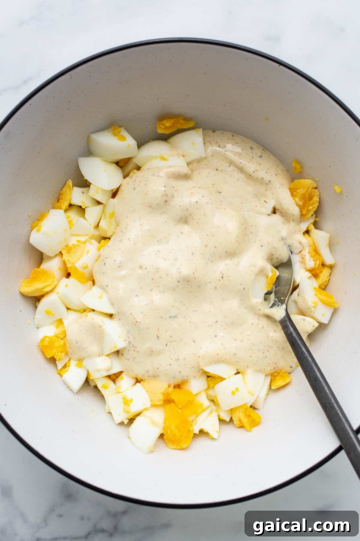 Classic egg salad is made with perfectly cooked hard-boiled eggs and a yummy sauce. A beautifully presented bowl of creamy classic egg salad, freshly prepared and irresistibly inviting.