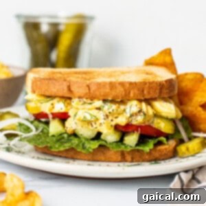 The Secret to Irresistible Egg Salad 3 A delicious and satisfying homemade egg salad sandwich, perfectly assembled on a pristine plate.