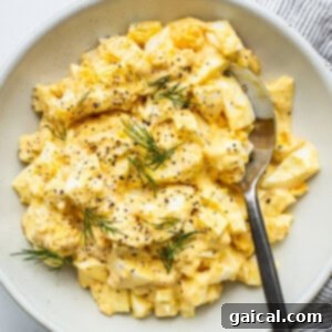 The Secret to Irresistible Egg Salad 4 Classic egg salad presented in a bowl, garnished and ready for serving, highlighting its irresistible texture.