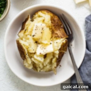 Instant Pot baked potato in a bowl, showing a fluffy interior.