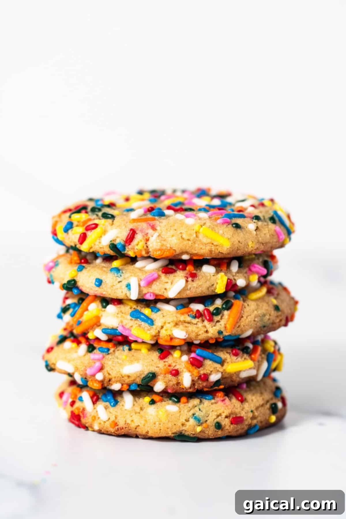 A delightful stack of masa cookies A stack of golden-brown masa cookies, highlighting their texture and sprinkles.