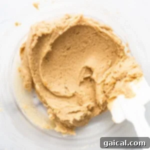 Wet ingredients in a mixing bowl for masa cookies, creamy and smooth.