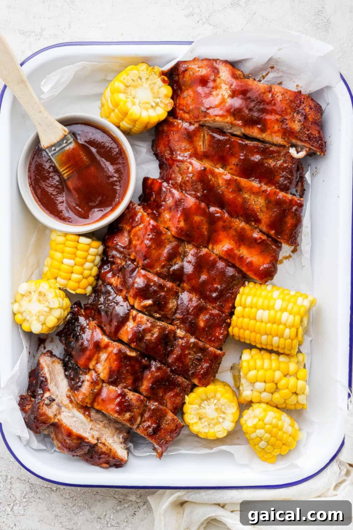 Serving tray filled with beautifully grilled baby back ribs, ready to eat.