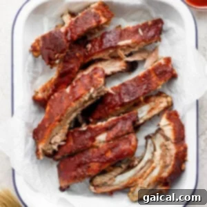 Delicious oven-baked ribs, dry-rubbed and glazed with BBQ sauce.