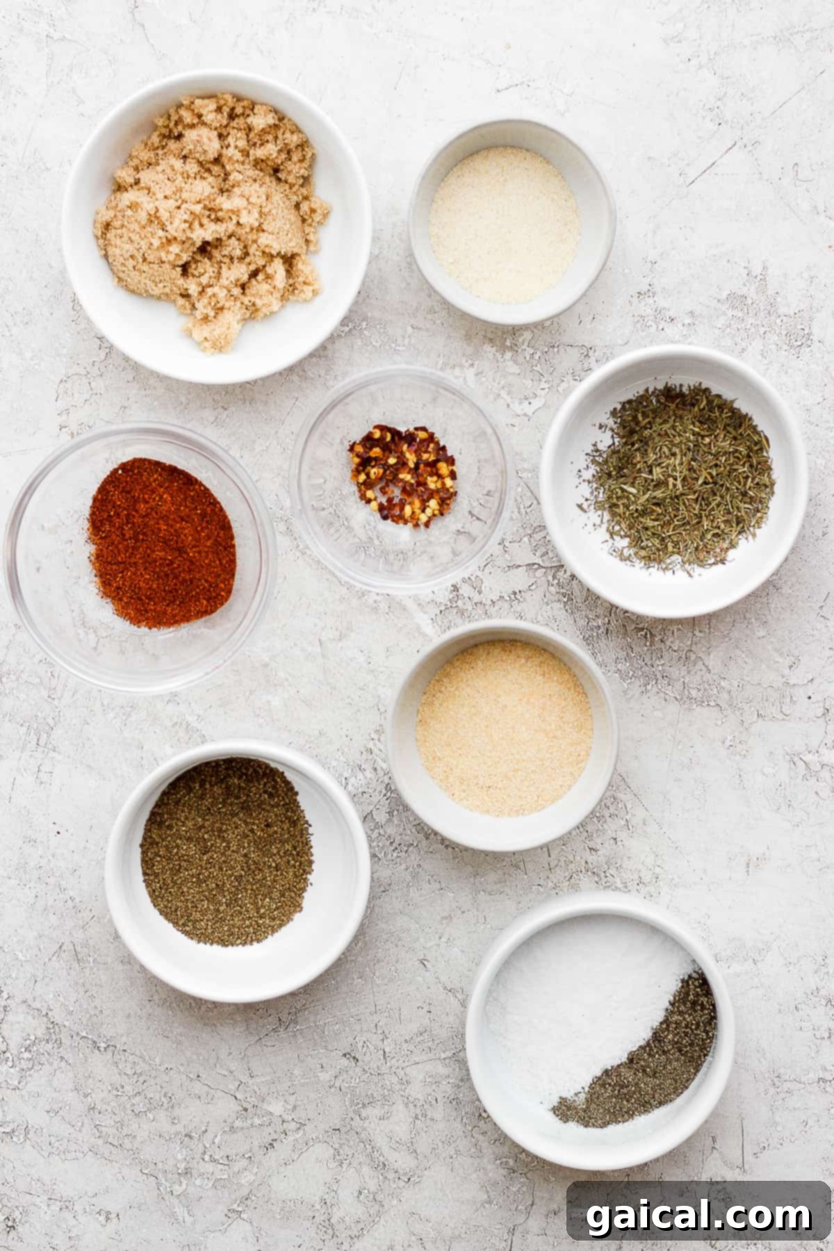 Key Ingredients for Your Perfect Rib Rub Individual bowls holding each ingredient for the rib rub, showcasing their vibrant colors and textures.