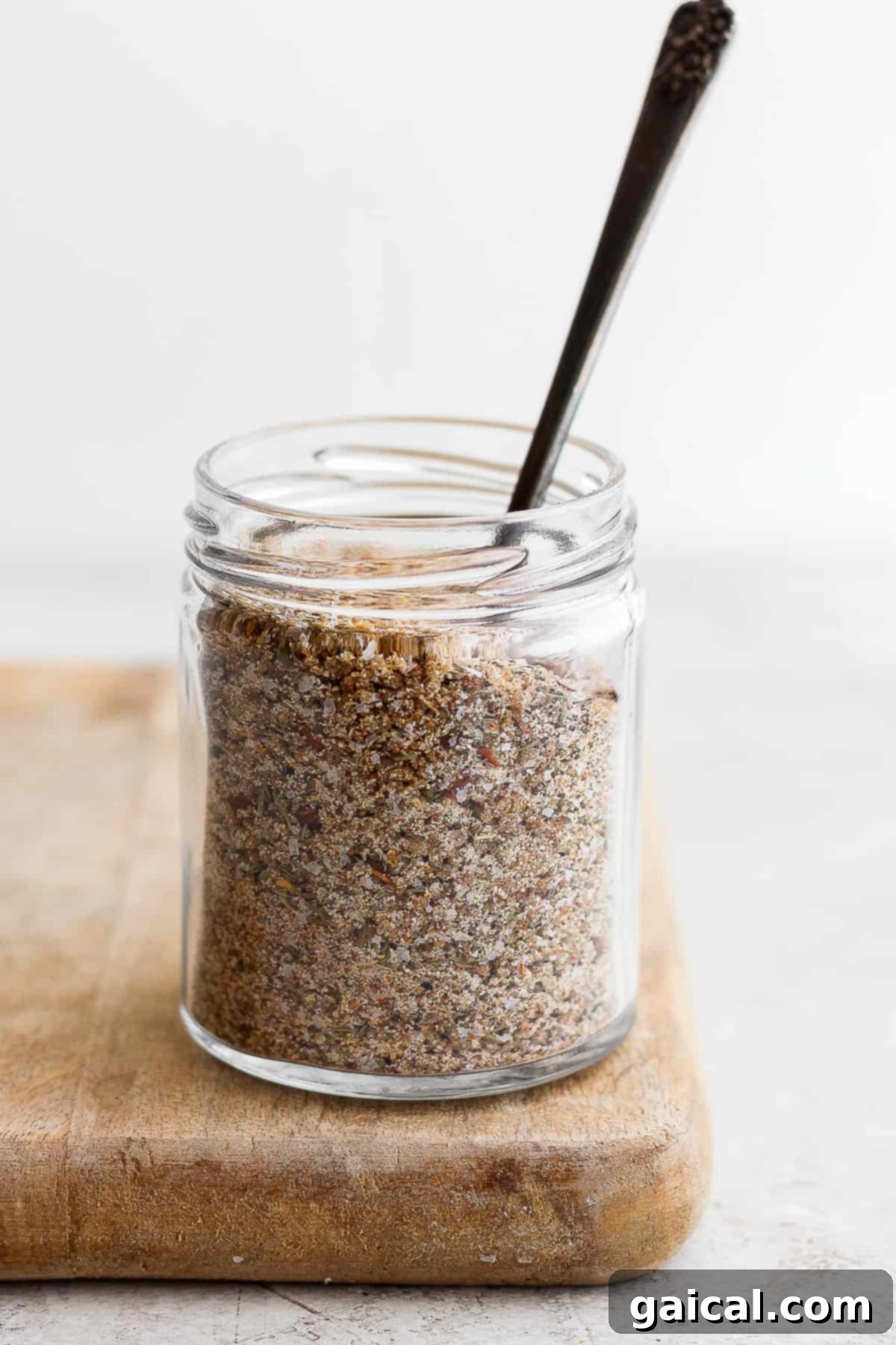 Storing Your Freshly Made Rib Rub Homemade rib rub stored in a clear glass jar, ready for use.