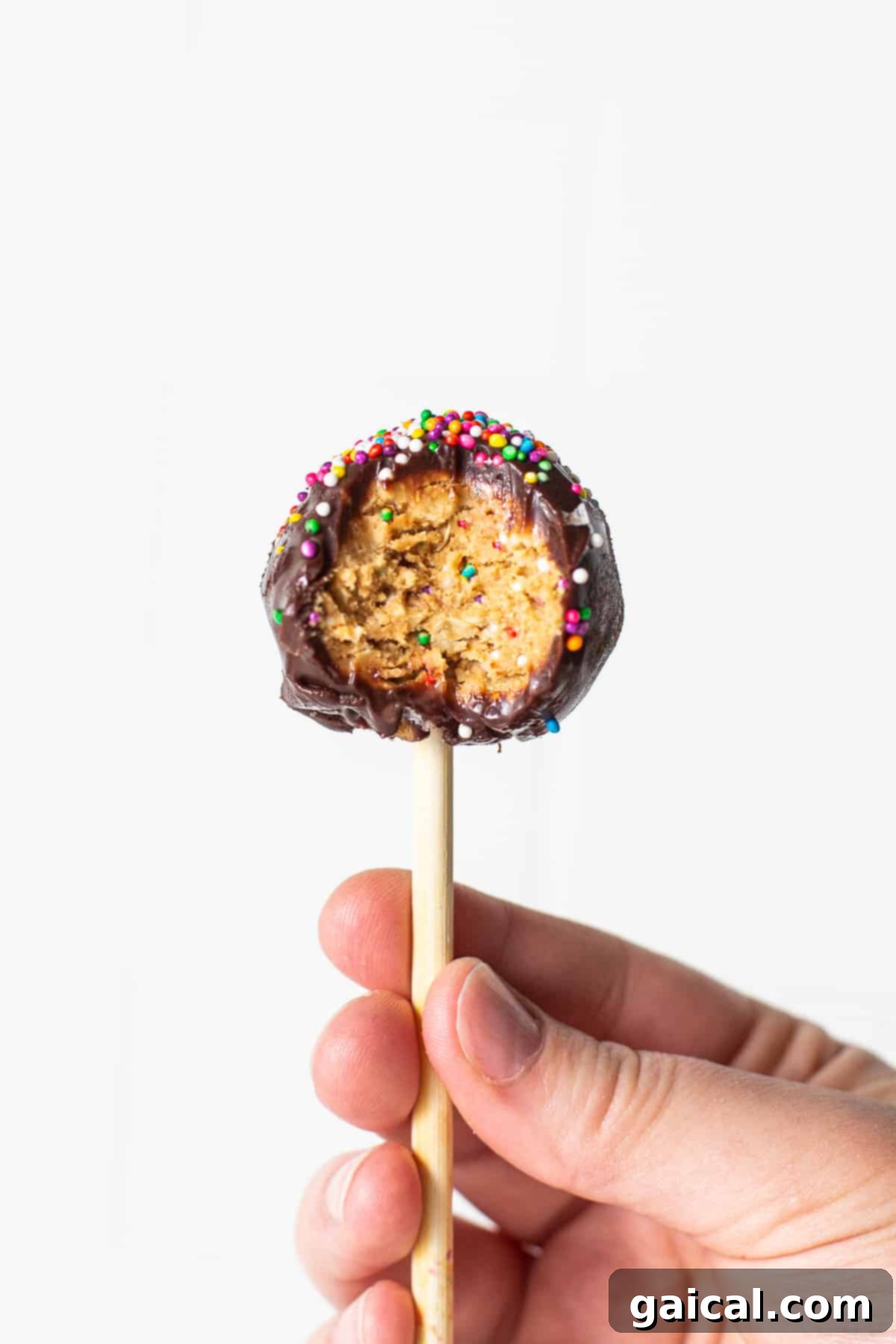 Protein-Packed Cake Pops 8 A protein cake pop with a delicious bite taken out of it, showing the soft interior.