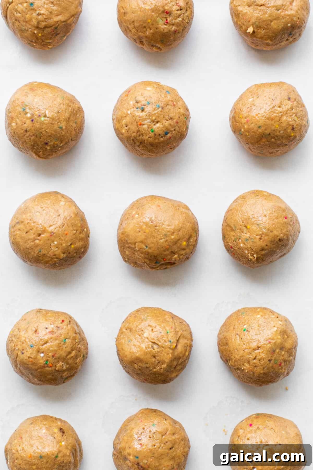 Protein-Packed Cake Pops 6 Batch of protein cake pop balls chilling on a cookie sheet.