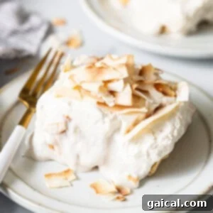 a white plate topped with a piece of cake.