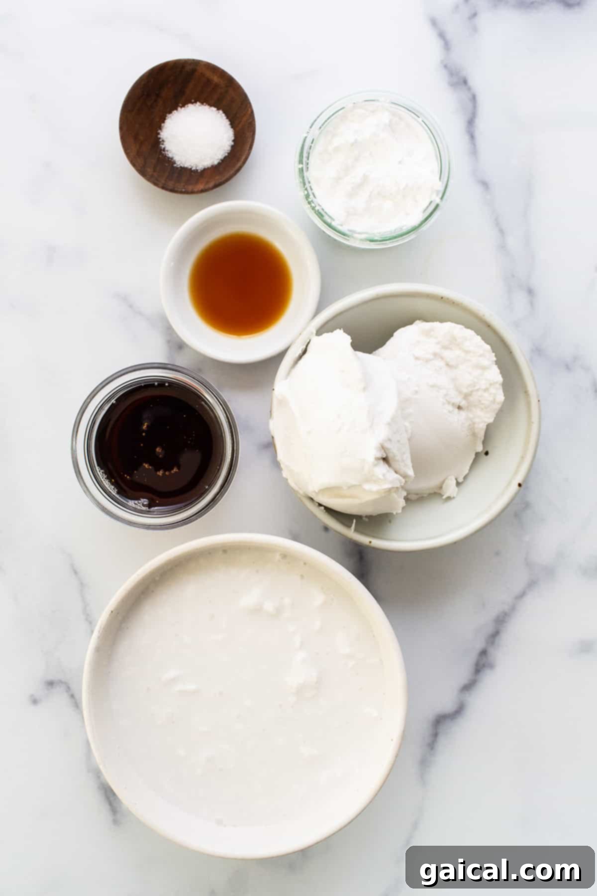 Creamy Coconut Dream Bars 3 A collection of essential ingredients for making coconut cream pie bars, including canned coconut milk and cream, agave, and vanilla extract.
