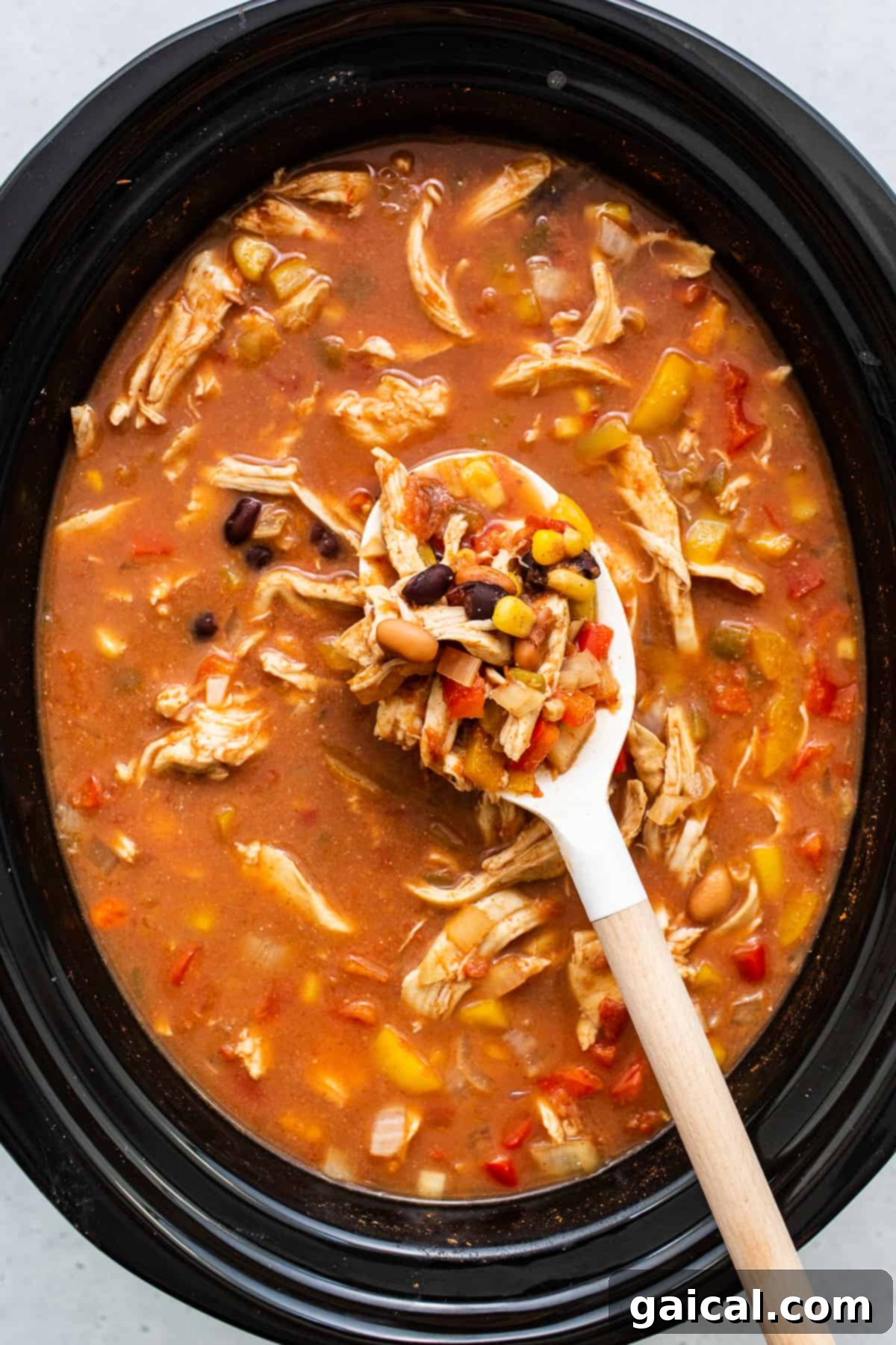 Slow Cooker Chicken Tortilla Soup Ready to Serve Rich and flavorful chicken tortilla soup simmering in a slow cooker, ready to be served.