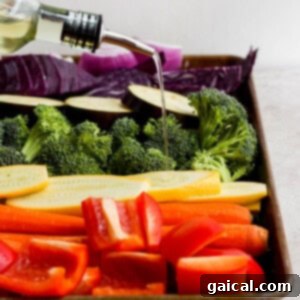 A tray filled with colorful, prepped vegetables and a bottle of wine in the background.