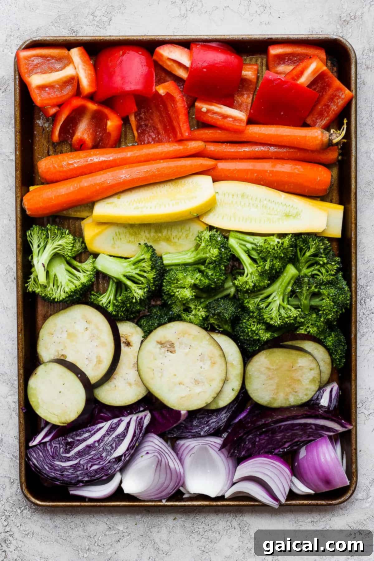 A vibrant assortment of perfectly grilled vegetables, beautifully arranged on a tray, showcasing their char marks and inviting colors.