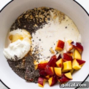 Golden Peach Overnight Bliss 8 A bowl with yogurt, peaches and chia seeds.
