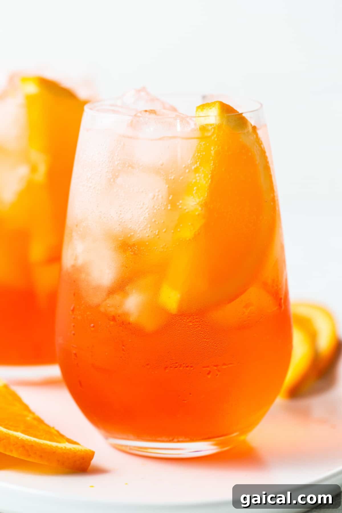 Sip into summer with this classic Aperol Spritz recipe – your ultimate refreshing cocktail. A beautifully garnished Aperol Spritz in a glass, ready to be enjoyed.
