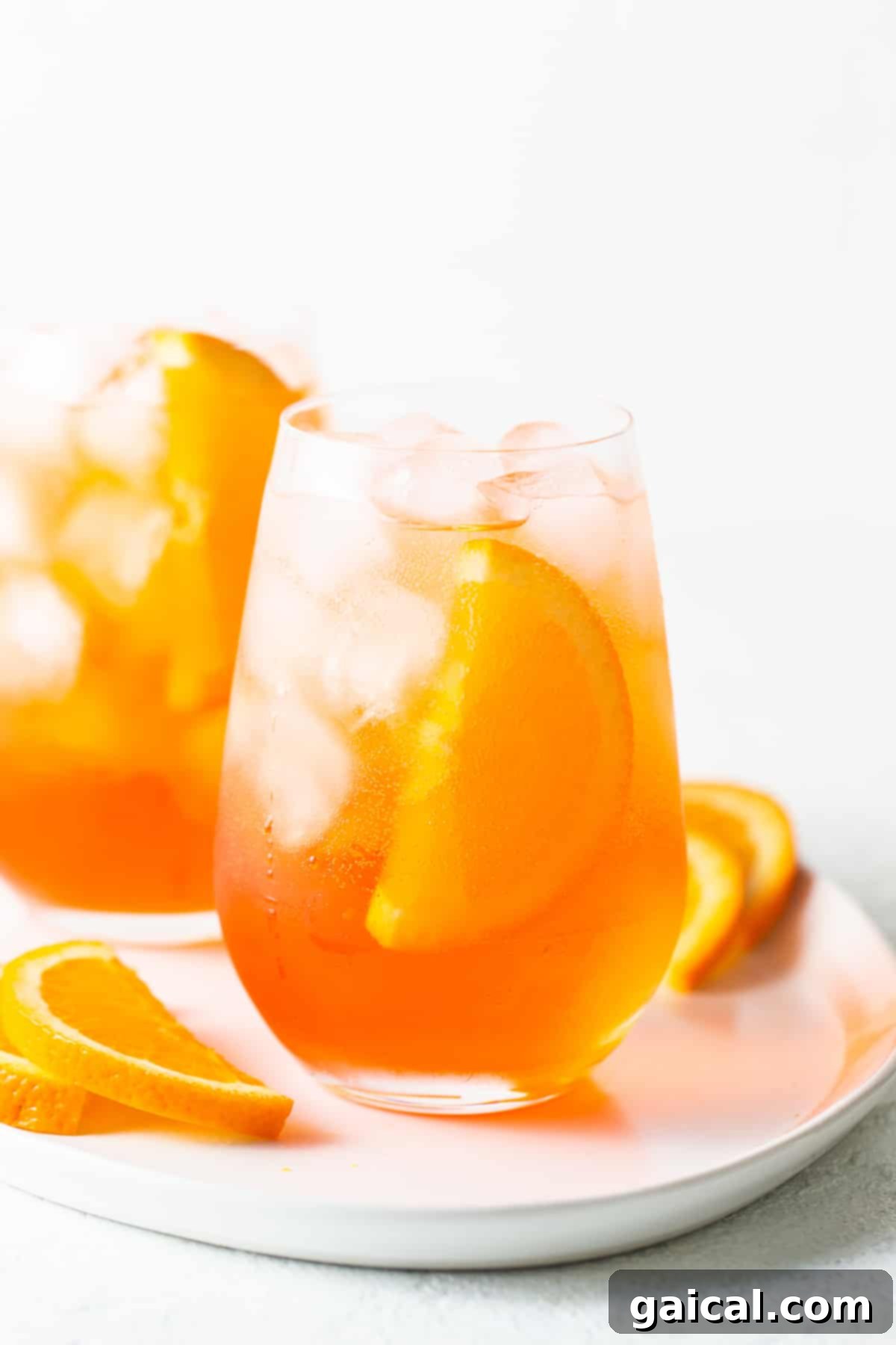 The ultimate refreshing Aperol Spritz, ready for enjoyment. A vibrant Aperol Spritz cocktail in a glass with ice and an orange garnish, perfect for a summer day.
