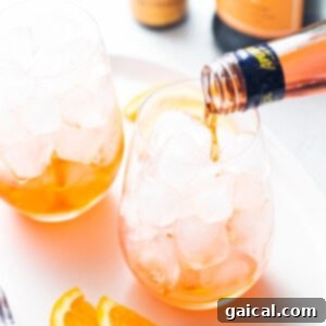 Iconic Aperol Spritz 4 Aperol being poured into a glass for aperol spritz.