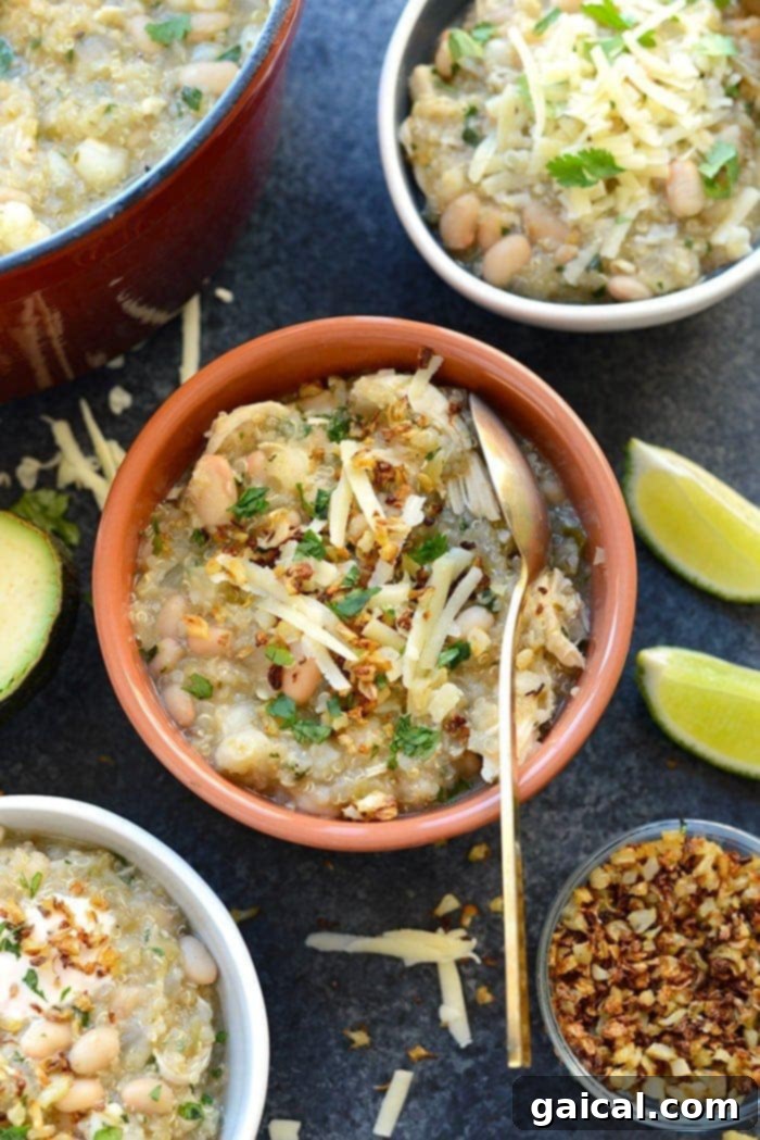 Wholesome White Chicken Quinoa Chili 2 A steaming bowl of wholesome White Chicken Quinoa Chili, garnished with fresh herbs and a dollop of Greek yogurt, perfect for a cozy meal.
